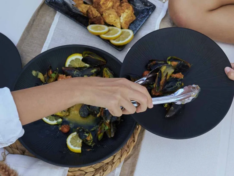 plate with seafood served on a catamaran